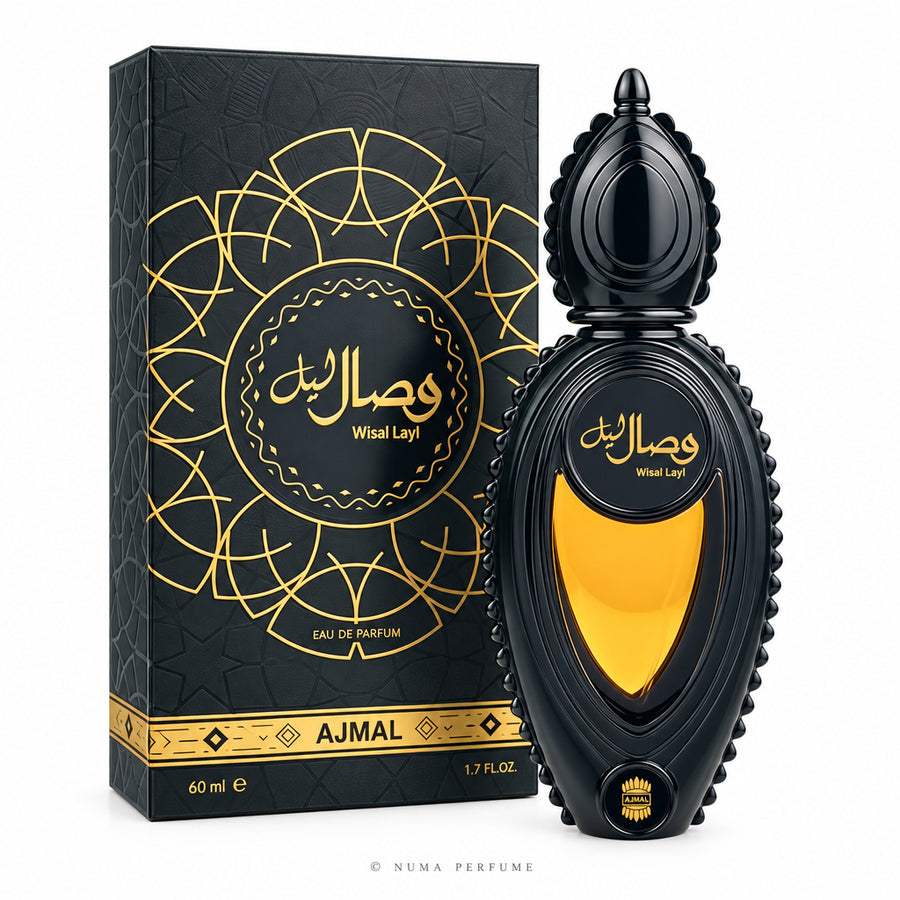 A bottle of Ajmal Wisal Layl Eau de Parfum next to its decorative packaging box. The bottle and box are dark black with intricate gold patterns and a prominent gold heart-shaped window on the bottle.