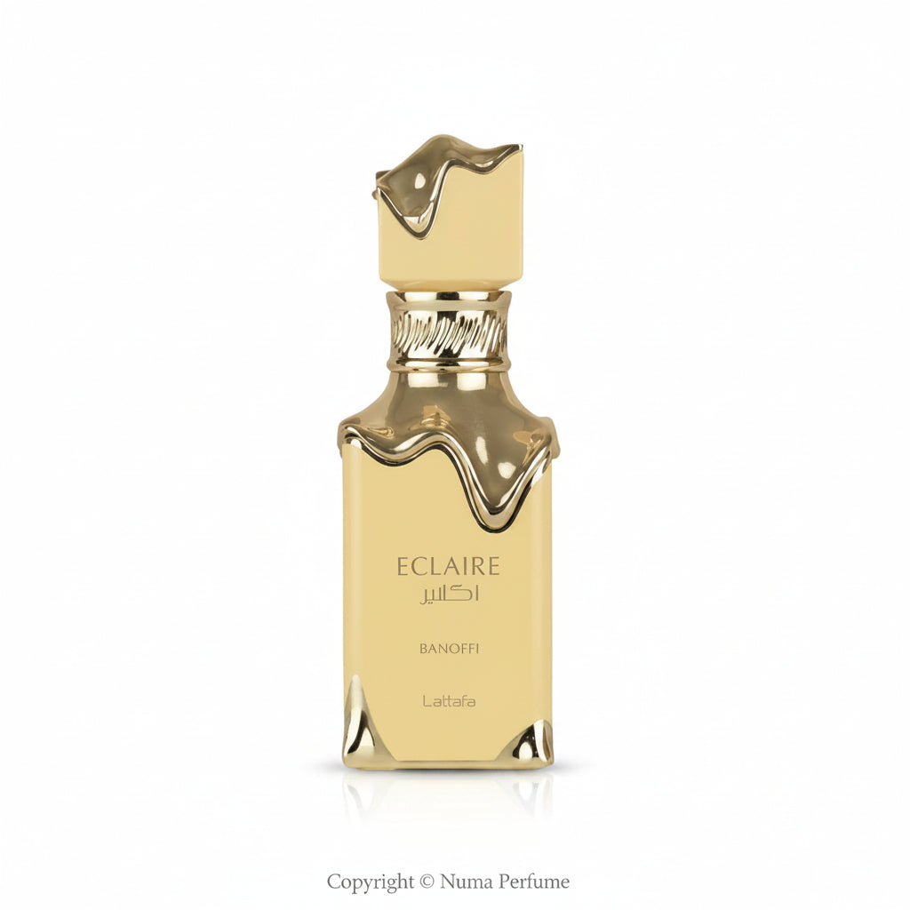 Gold perfume bottle with 'Eclaire' branding on a white background