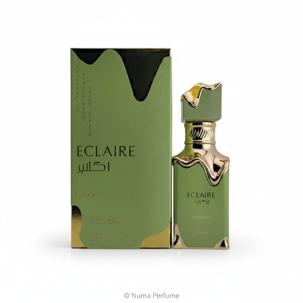 Eclair by Lattafa perfume bottle and its matching green packaging box, featuring a metallic gold wavy accent and gold lettering on a white background.