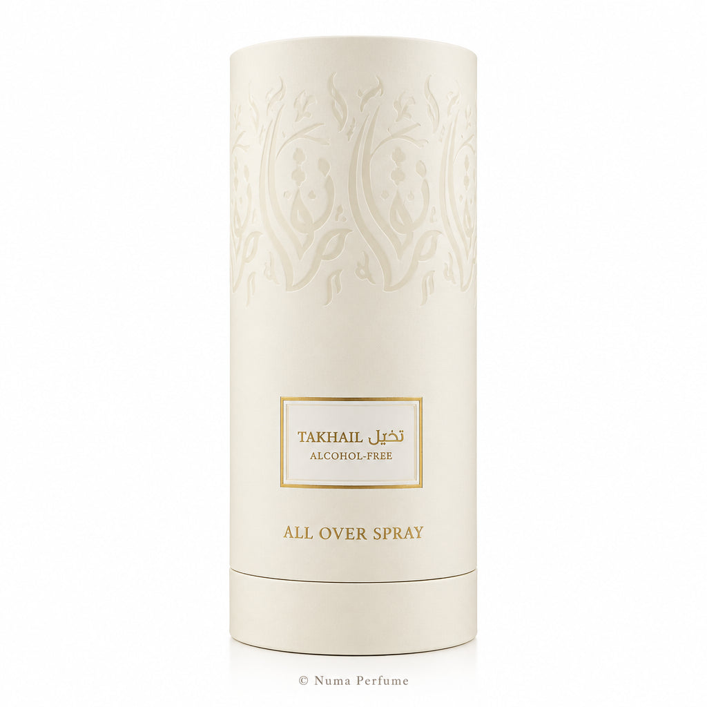 A tall, cylindrical off-white cardboard packaging container for Takhal All Over Spray, featuring embossed floral patterns and a central gold-bordered label with Arabic and English text.