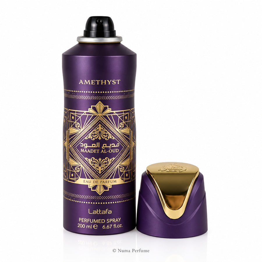 Amethyst perfume spray bottle with gold design on a white background