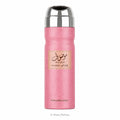 A pink textured cylindrical perfume spray bottle with a shiny silver metallic cap, featuring a central beige label with Arabic calligraphy and the brand name Wardi Mousuf.