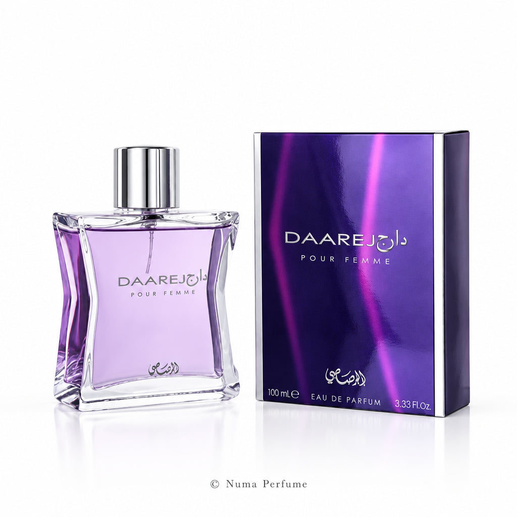 A bottle of Daarejib Pour Femme Eau de Parfum with a silver cap next to its purple and black packaging box, on a white background.