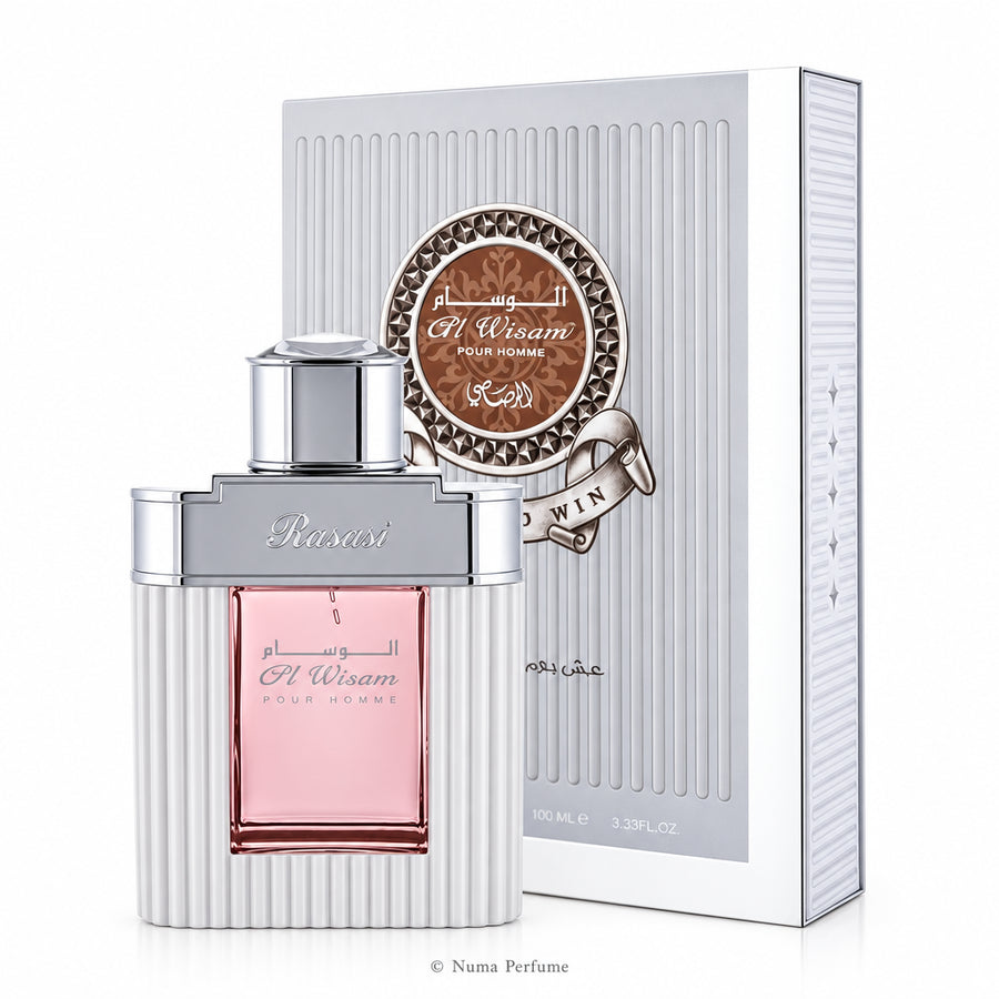Perfume bottle with pink liquid and silver cap next to its packaging on a white background